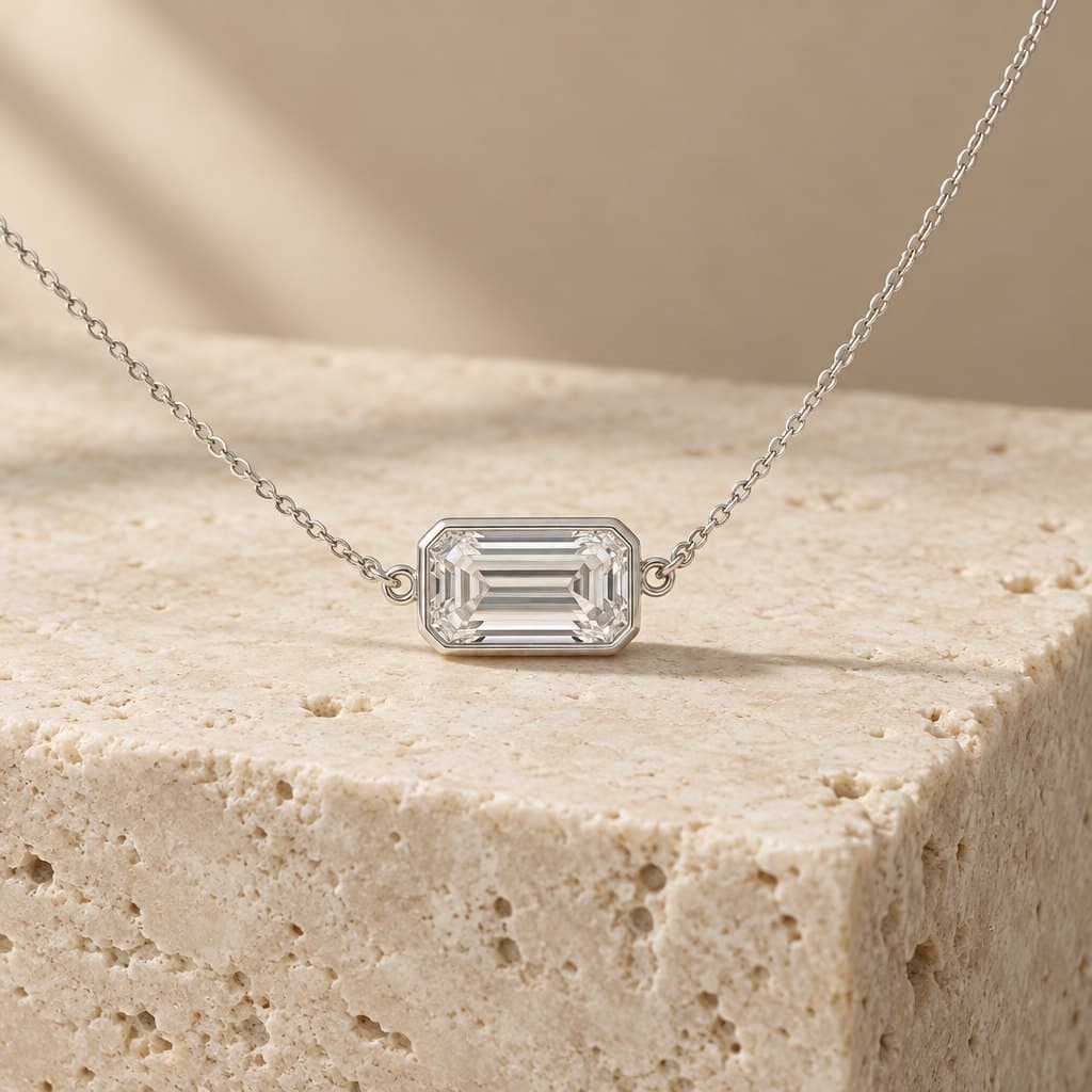 Design render of the Prism east-west emerald-cut pendant